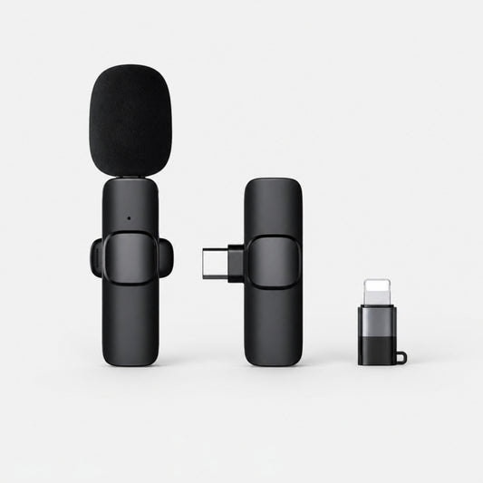 Black wireless lavalier clip-on microphone with USB-C receiver and Lightning adapter on a light gray studio background